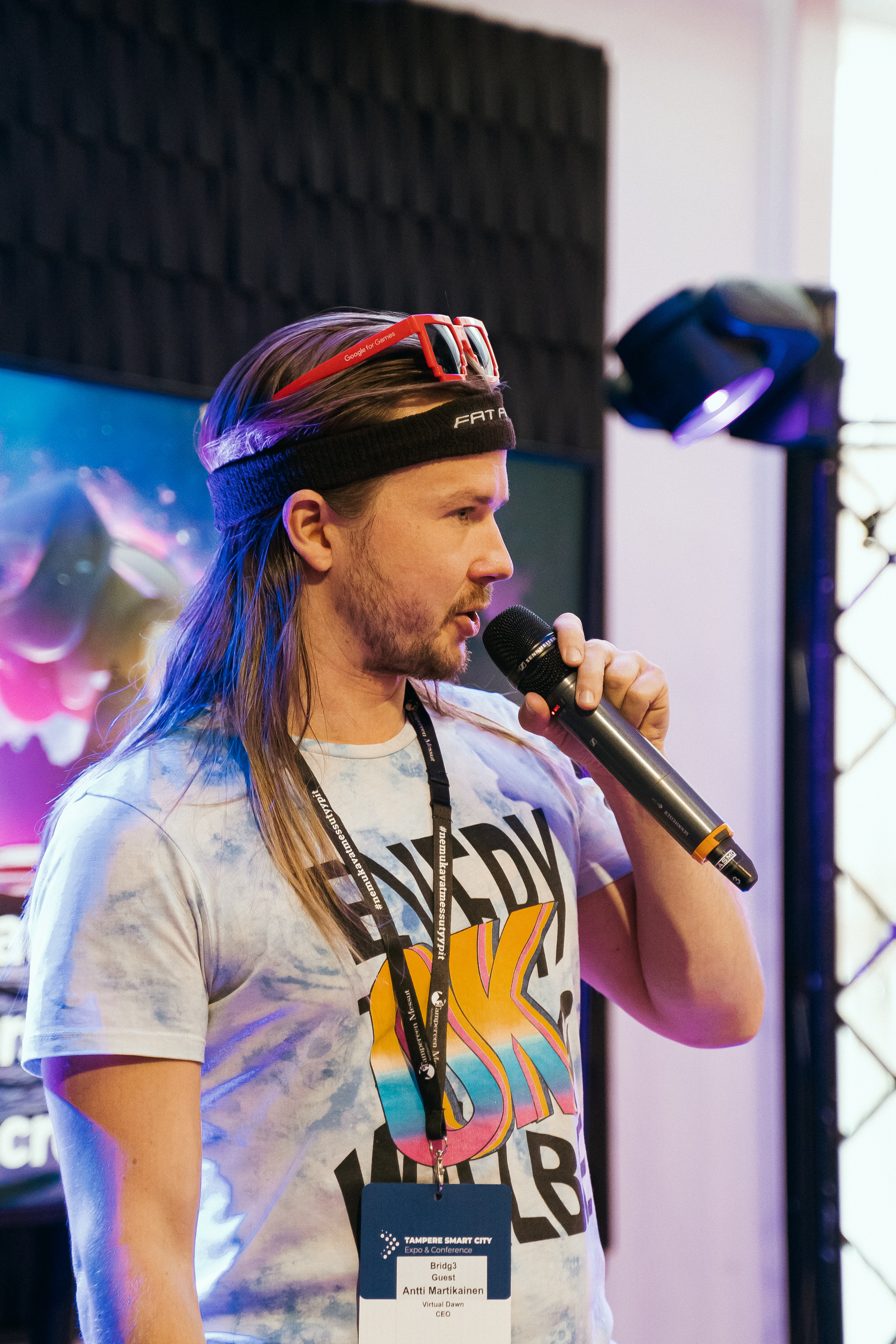 Antti Martikainen speaking on stage